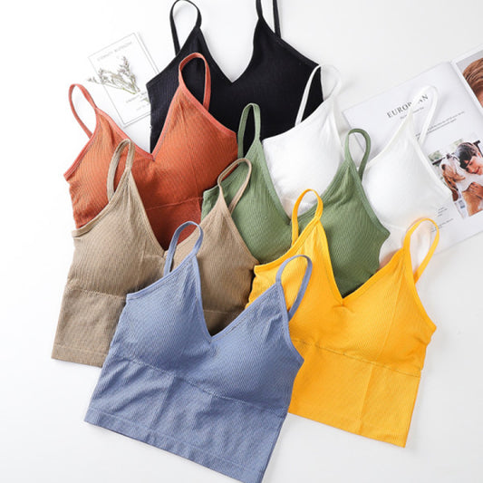 BraletteCrop top bra in soft blue fabric with V neck design and adjustable straps on a flat surface.